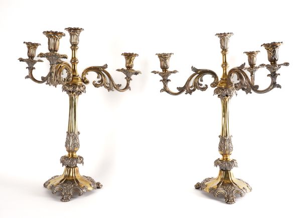 A PAIR OF  VICTORIAN FOUR LIGHT SILVER-PLATED TABLE CANDELABRA