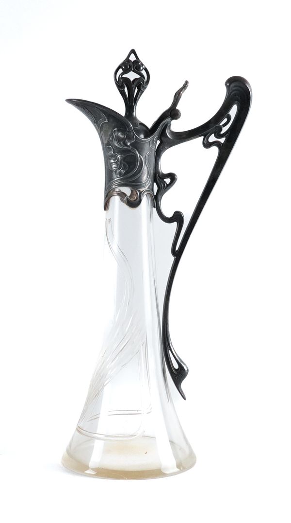 A FORMERLY SILVER PLATED METAL MOUNTED ART NOUVEAU GLASS CLARET JUG