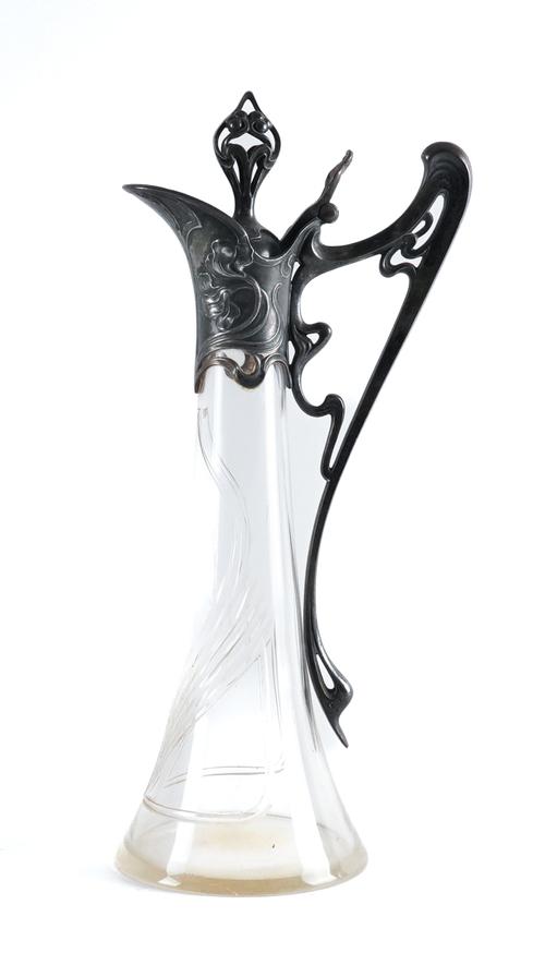 A FORMERLY SILVER PLATED METAL MOUNTED ART NOUVEAU GLASS CLARET JUG