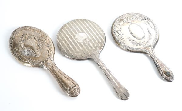 THREE LADY'S SILVER MOUNTED HAND MIRRORS (3)