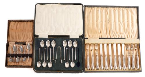 ELEVEN SILVER TEASPOONS AND A PAIR OF SILVER SUGAR TONGS AND TWO FURTHER CASED SETS OF FLATWARE (3)
