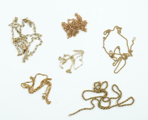 A 9CT GOLD SCORPIO PENDANT WITH A 9CT GOLD NECKCHAIN AND FIVE FURTHER MOSTLY GOLD NECKCHAINS (7)