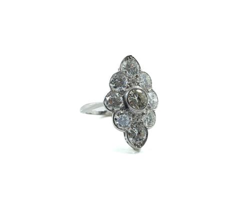 A WHITE GOLD AND DIAMOND NAVETTE SHAPED CLUSTER RING