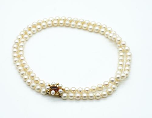 A TWO ROW NECKLACE OF UNIFORM CULTURED PEARLS