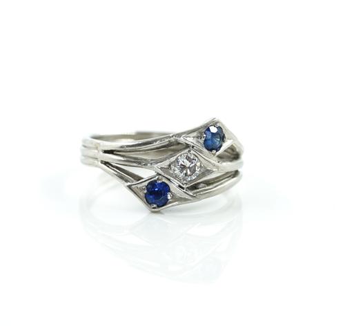 A SAPPHIRE AND DIAMOND THREE STONE RING