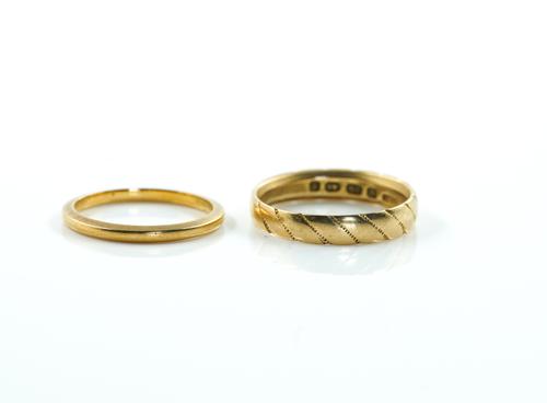 TWO GOLD WEDDING RINGS (2)