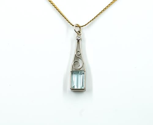 A BLUE TOPAZ AND DIAMOND PENDANT AND A GOLD NECKCHAIN (2)
