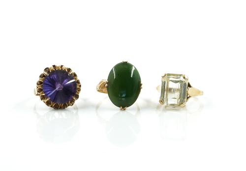 THREE GOLD AND GEM SET SOLITAIRE RINGS (3)