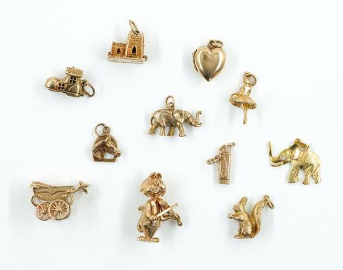 TEN 9CT GOLD CHARMS AND A GOLD AND DIAMOND PENDANT (11)