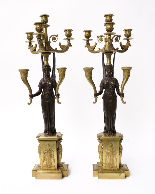 A PAIR OF FRENCH EMPIRE GILT AND PATINATED BRONZE SIX-LIGHT CANDELABRA (2)