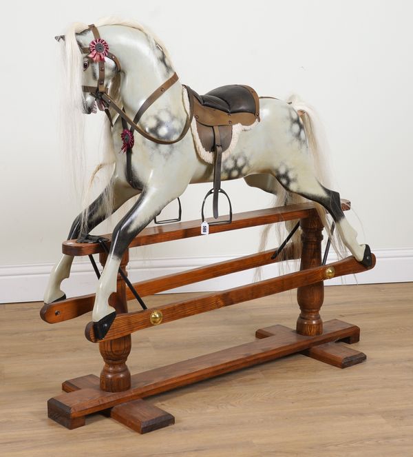 A PAINTED DAPPLE GREY ROCKING HORSE