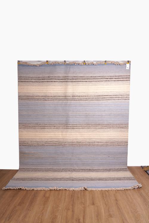 A FLATWEAVE WOOLLEN CARPET