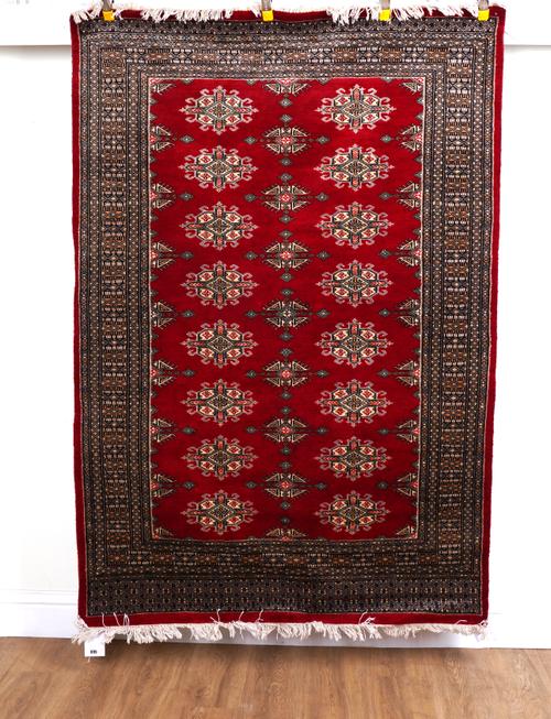 ONE RED RUG AND A PAIR OF RED RUNNERS