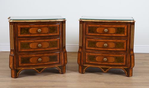 PROVASI: A PAIR OF KINGWOOD AND WALNUT PARCEL GILT BOWFRONT THREE DRAWER BEDSIDE TABLES  (2)