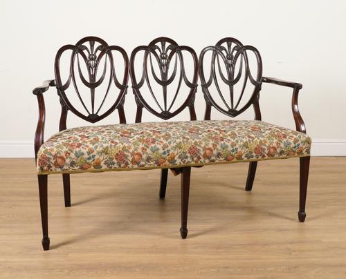 A GEORGE III MAHOGANY TRIPLE CHAIR-BACK SOFA