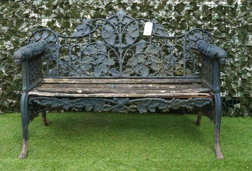 AFTER COALBROOKDALE: A GREEN PAINTED CAST IRON OAK AND IVY PATTERN BENCH