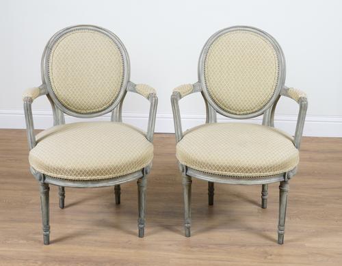 A PAIR OF LOUIS XVI STYLE OPEN ARMCHAIRS (2)