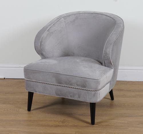 A LIGHT BLUE VELVET UPHOLSTERED TUB CHAIR