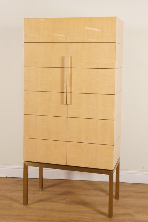 A LACQUERED STAINED SATINWOOD CABINET