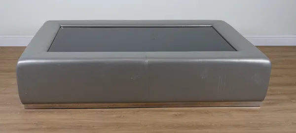 A SILVER COLOURED LEATHER UPHOLSTERED RECTANGULAR COFFEE TABLE