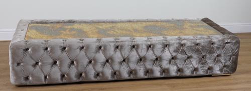 A VELVET UPHOLSTERED RECTANGULAR COFFEE TABLE