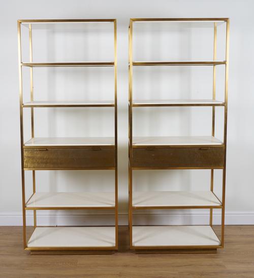 A PAIR OF BRASS FLOOR STANDING OPEN BOOKCASES