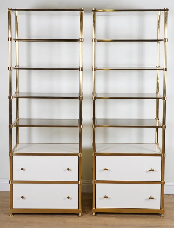 A PAIR OF BRASS FLOOR STANDING OPEN BOOKCASES