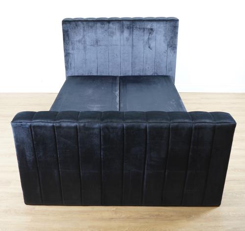 A NAVY BLUE VELVET UPHOLSTERED BED HEADBOARD AND FOOTBOARD