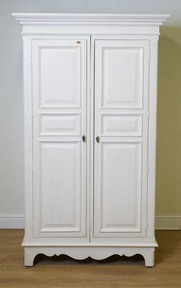 A MODERN WHITE PAINTED TWO DOOR WARDROBE