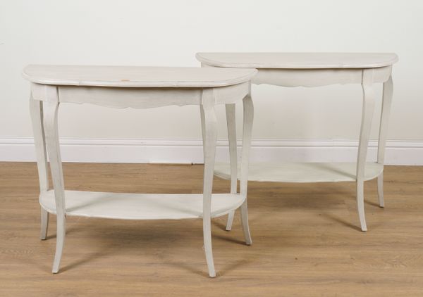 A PAIR OF MODERN PAINTED SHAPED DEMI-LUNE TWO TIER SIDE TABLES (2)