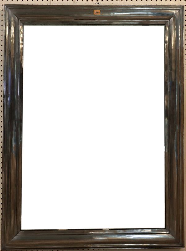 A MODERN SILVERED METAL RECTANGULAR WALL MIRROR