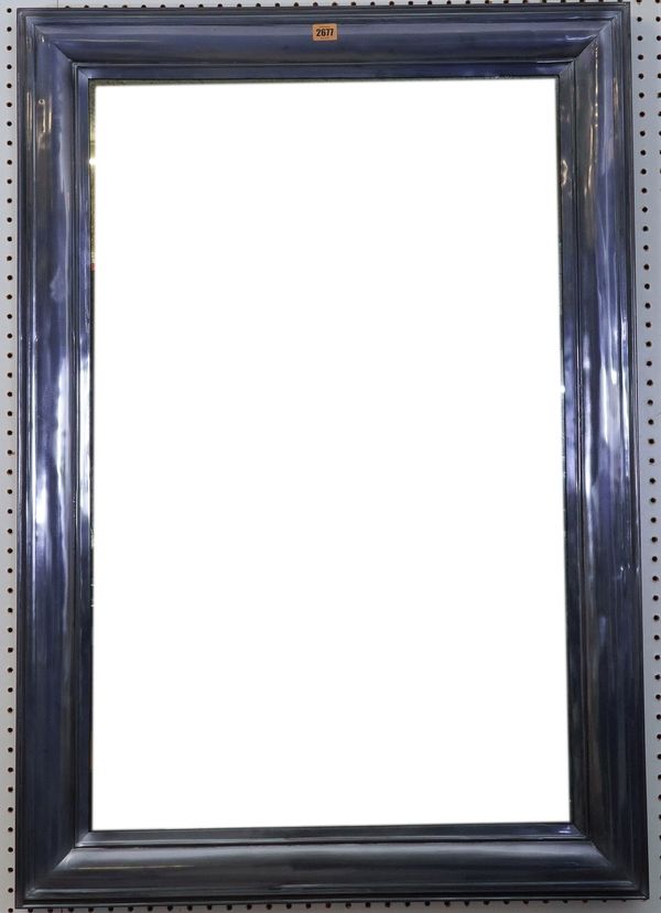 A MODERN SILVERED METAL RECTANGULAR WALL MIRROR