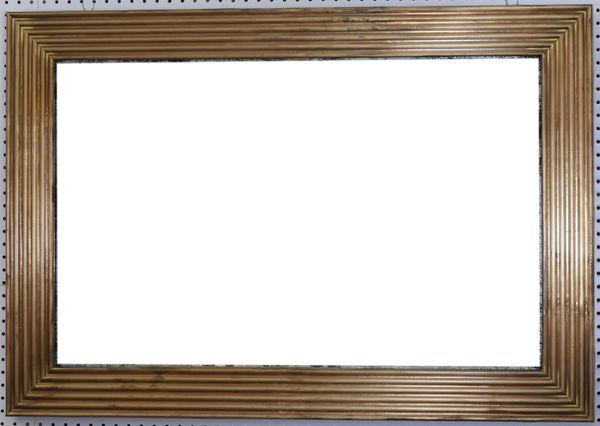 A MODERN BRASS RECTANGULAR WALL MIRROR