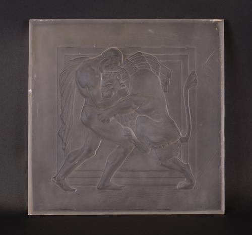 AN ART DECO FROSTED AND MOULDED GLASS PANEL OF HERCULES WRESTLING WITH THE NEMEAN LION