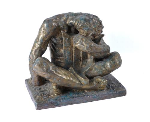 EDWARD CAZAUX (1889-1974); A LUSTRE GLAZED TERRACOTTA SEATED FIGURE OF ‘THE POET’