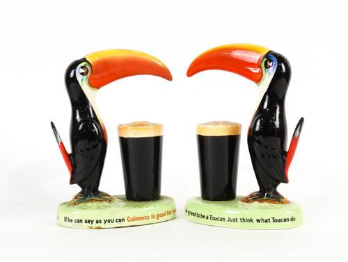 A CARLTON WARE GUINNESS LAMPBASE MODELLED AS A TOUCAN AND A SIMILAR TOUCAN FIGURE (2)