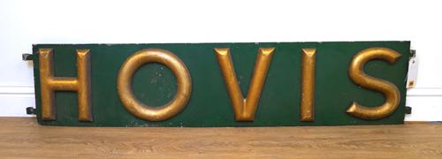 HOVIS, A GREEN ENAMEL AND GILT METAL ADVERTISING SIGN