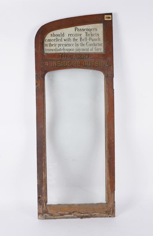 AN EARLY 20TH CENTURY OAK AND GLASS DOOR, POSSIBLY FROM A TRAM