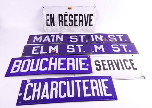 SEVEN SMALL AMERICAN AND FRENCH ENAMEL SIGNS