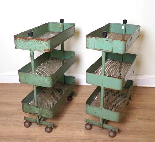 A PAIR OF MID 20TH CENTURY GREEN METAL THREE TIER ETAGERES OR UTILITY TROLLEYS (2)