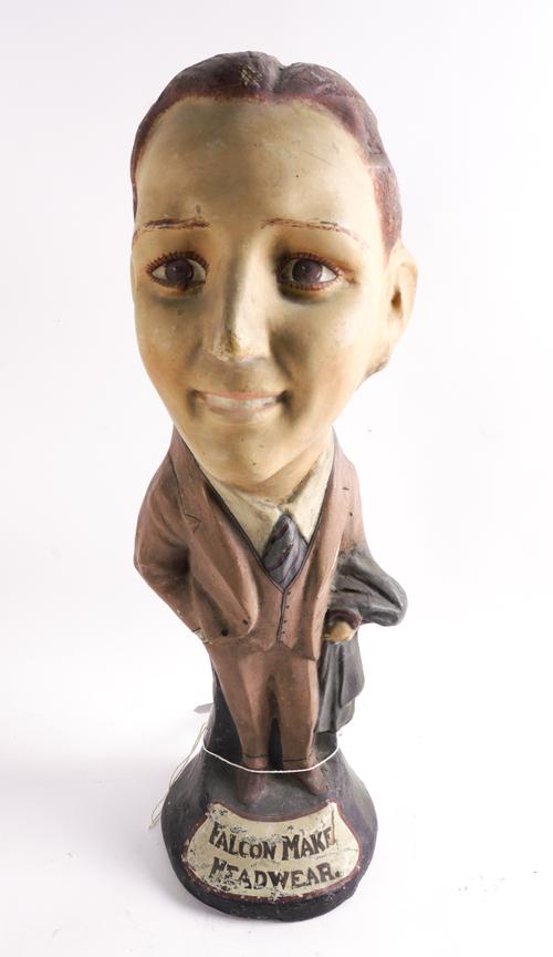 FALCON MAKE HEADWEAR, A MID 20TH CENTURY COMPOSITE ADVERTISING FIGURE