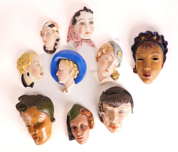 A GROUP OF ART DECO STYLE WALL MASKS (9)