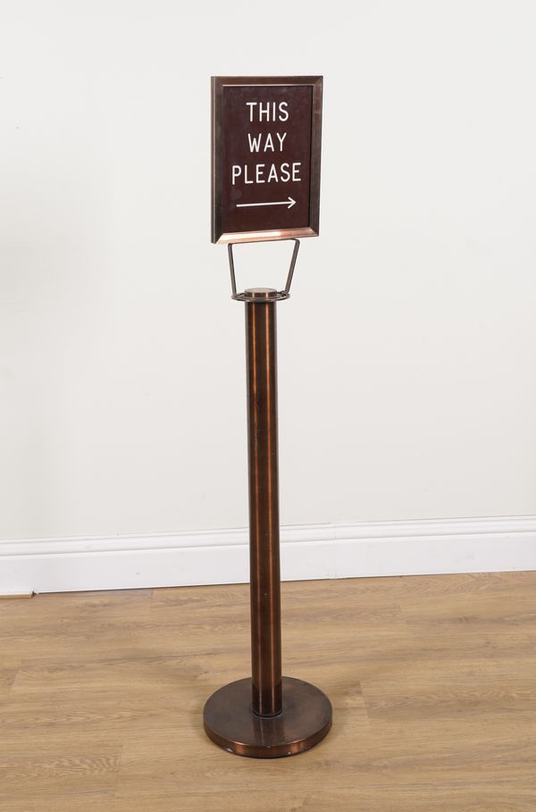 A 20TH CENTURY COPPER EFFECT PEDESTAL SIGN "THIS WAY PLEASE"