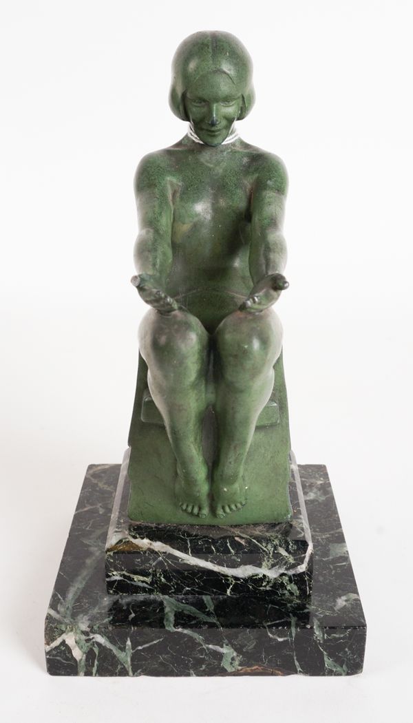 MAX LE VERRIER (1891-1973); A GREEN PATINATED SPELTER FIGURAL LAMP MODELLED AS AN ART DECO GIRL