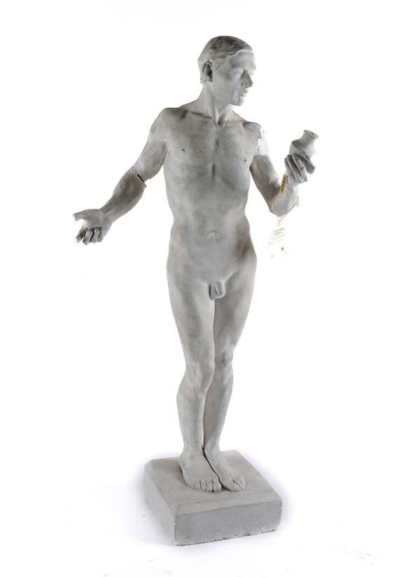 PETER INDUNI (SWISS, 1883-1943); A PLASTER SCULPTED FIGURE OF A YOUNG MAN STUDYING A VASE