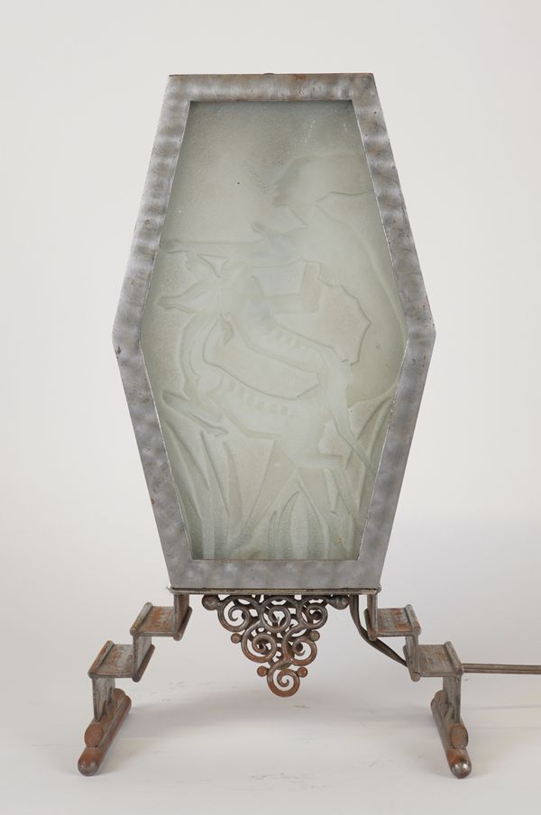 AN ART DECO RELIEF AND FROSTED GLASS BRUSHED STEEL TABLE LAMP