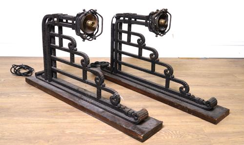 A PAIR OF ART DECO WROUGHT IRON WALL LIGHTS IN THE MANNER OF PAUL KISS