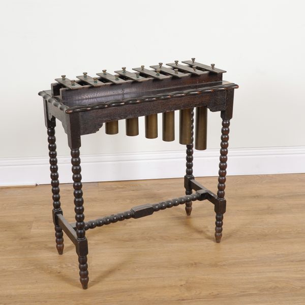 AN EARLY 20TH CENTURY OAK FRAMED XYLOPHONE