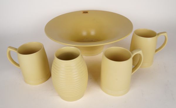 KEITH MURRAY FOR WEDGWOOD: A GLAZED EARTHENWARE BOWL, A VASE AND THREE MUGS (5)