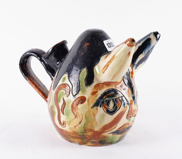 AN UNUSUAL CONTINENTAL SLIPWARE POURING VESSEL